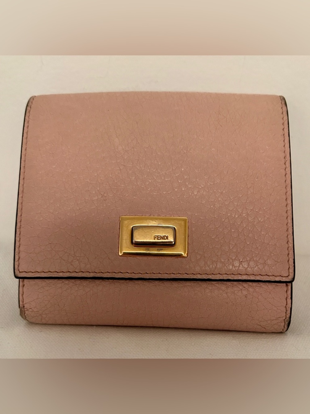 Fendi Peekaboo Bi-fold Wallet in Blush pink leather with gold-finish metalware.